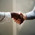 Shaking hands, illustrating customer service.
