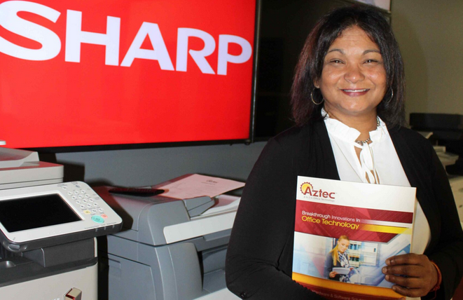 Charlie Mohammed, Customer Service Manager, in printer and copier showroom.